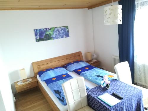 Ein Bett oder Betten in einem Zimmer der Unterkunft Frühstückspension See-Panorama