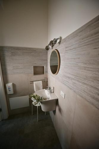 a bathroom with a sink and a mirror at Inkantu B&B in Terrasini
