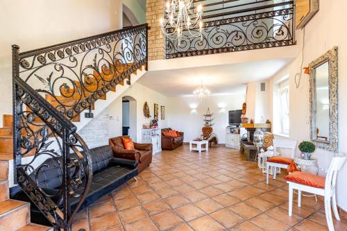 a living room with a staircase and a living room at House "Dare to dream" in Vrdnik