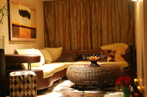 a living room with a couch and a table at Teton Club in Teton Village