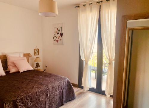 A bed or beds in a room at APPARTEMENT LES COLLINES