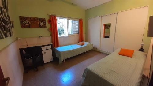 Tempat tidur dalam kamar di Casa Cosquin