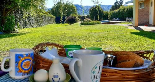 a basket of food and eggs on a table at Casa Cosquin in Cosquín