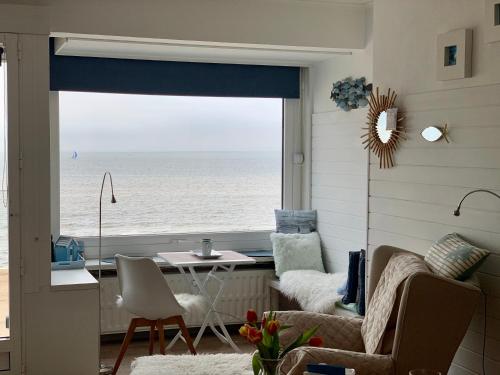 a living room with a view of the ocean at Santiago seaview in Ostend
