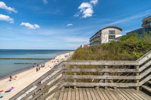 a view of the beach from the boardwalk at Na Klifie - Apartamenty KOMFORT, widok na morze, parking in Ustronie Morskie