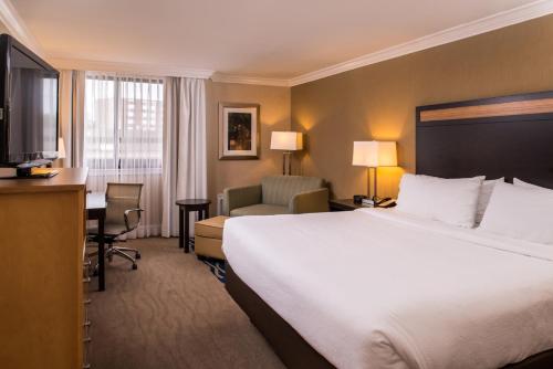 A bed or beds in a room at Holiday Inn Concord Downtown, an IHG Hotel