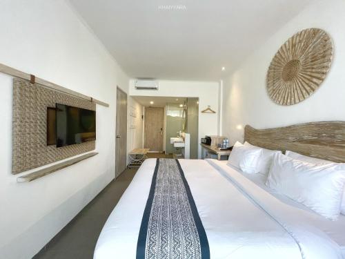 Кровать или кровати в номере Khaiyyara Jimbaran Bali