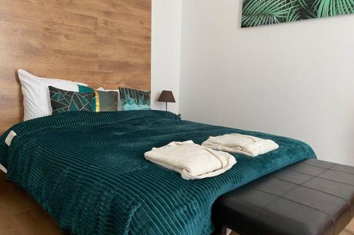 Postel nebo postele na pokoji v ubytování Esprit Luxe .... au coeur de Mulhouse