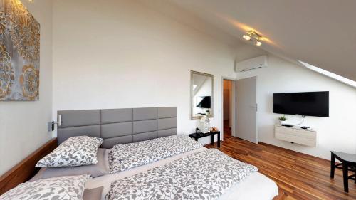 Ένα ή περισσότερα κρεβάτια σε δωμάτιο στο Central Home Budapest
