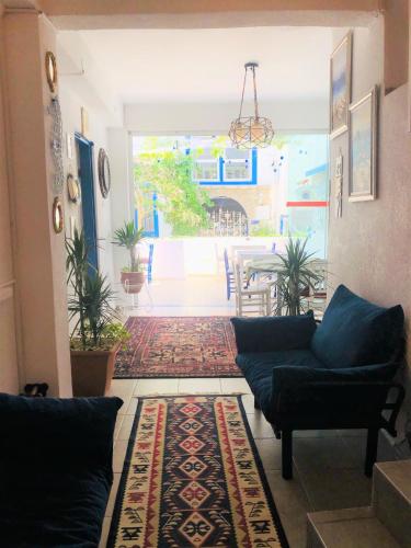 a living room with a couch and a table at Denizati Pension in Bodrum City