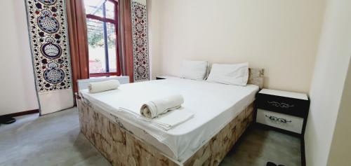 Postel nebo postele na pokoji v ubytování Riad Nur & Tours