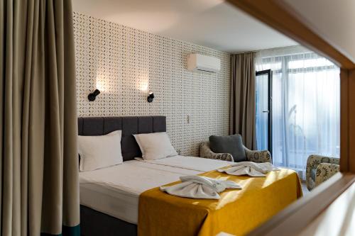 Family Hotel LAXOにあるベッド