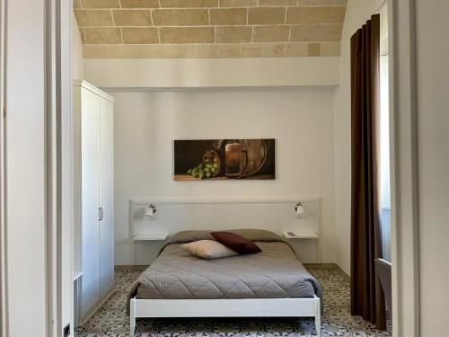 萊韋拉諾的住宿－Casa Birra Salento，卧室配有一张床