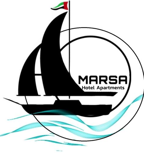 a boat in the water with a black sail at AL MARSA HOTEL APARTMENTS in Khor Fakkan
