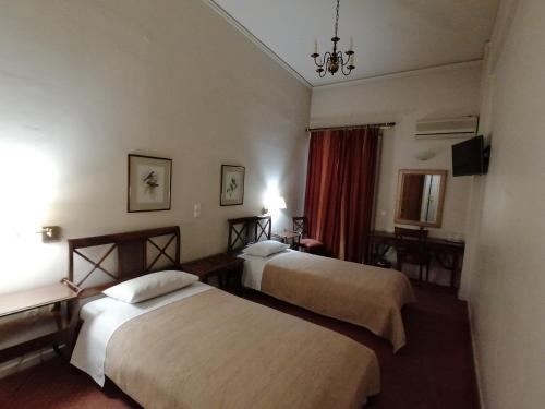 Postel nebo postele na pokoji v ubytování Hotel Galaxias