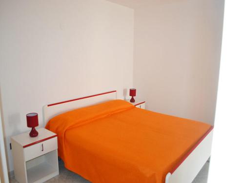 Ένα ή περισσότερα κρεβάτια σε δωμάτιο στο Casavacanza vicino la spiaggia Ll71