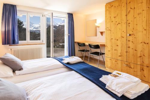 Postel nebo postele na pokoji v ubytování Chalet Steingärtli 1