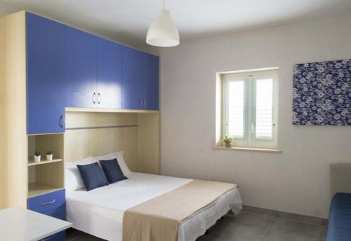 Ένα ή περισσότερα κρεβάτια σε δωμάτιο στο Villa Cisterna - Direzione Salento