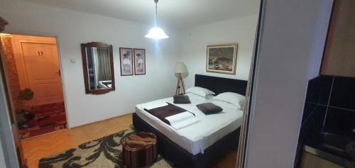 Postel nebo postele na pokoji v ubytování Apartments Kuljaca