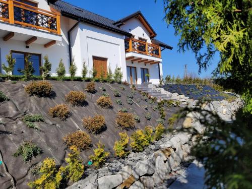 a house with plants on the side of it at Karolowy pokoje&apartamenty in Ustroń