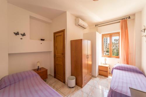 Postel nebo postele na pokoji v ubytování L'Aragosta Guesthouse