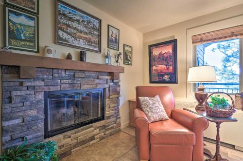 a living room with a fireplace and a chair at Bend Condo with Deck, Resort-Style Amenities and Views in Bend