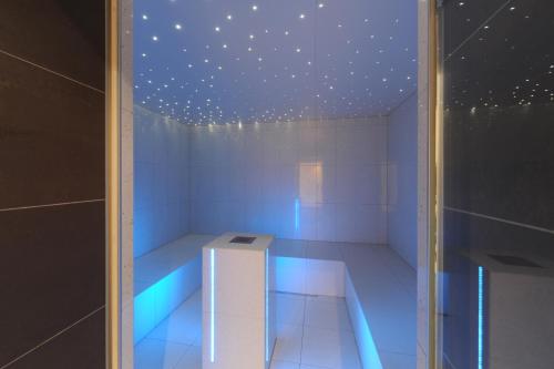 a white room with a ceiling with stars at Alpine Hotel Perren in Zermatt