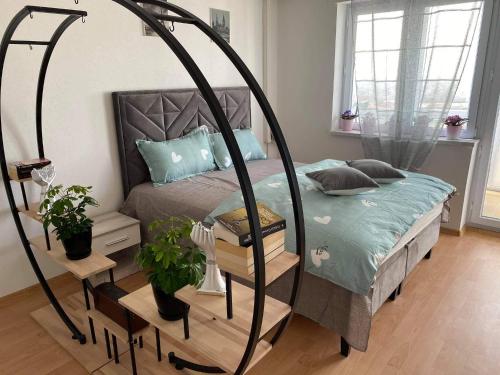מיטה או מיטות בחדר ב-Kula Apartman
