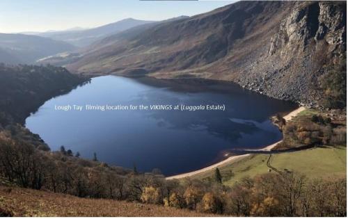 a view of a lake in a mountain valley at Wonderful Setting Farmhouse Apartment in Wicklow