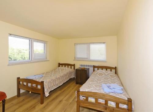 Ένα ή περισσότερα κρεβάτια σε δωμάτιο στο Garni Bread House