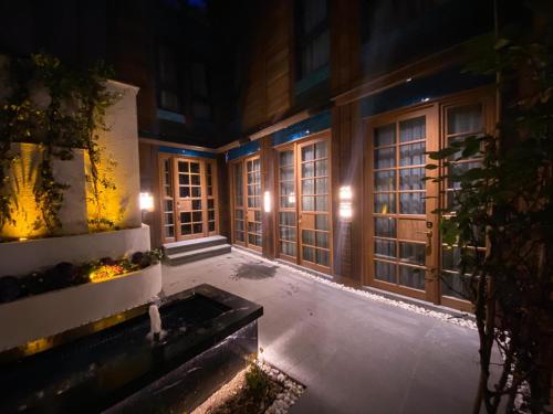 a building with a courtyard at night with lights at Henna Hotel Istanbul in Istanbul