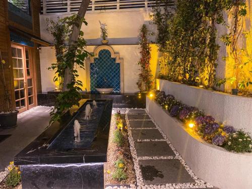 a garden with a dog in the middle of a building at Henna Hotel Istanbul in Istanbul