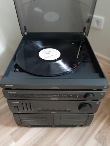 a cd sitting on top of a stack ofds at Aqua apartments in Druskininkai