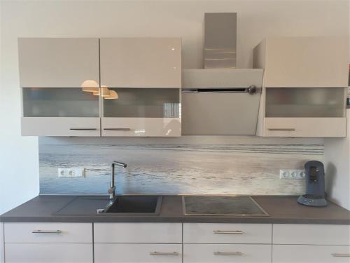 Kuchyň nebo kuchyňský kout v ubytování Apartment Quellblick, Am Alten Deich 4-6, Whg 6