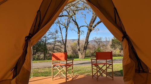 two chairs sitting inside of a tent at Wildhaven Sonoma Glamping in Healdsburg