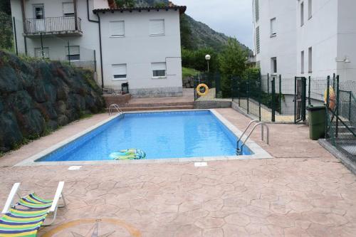 a swimming pool in the middle of a building at La Fuente de la Quintana in Arredondo