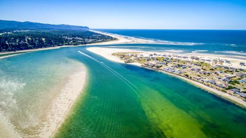 an aerial view of a beach with a resort at Windsong Hideaway in Waldport