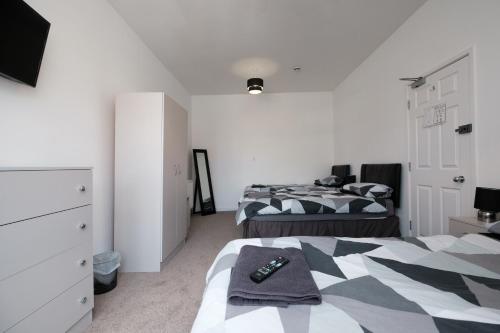 A bed or beds in a room at The Pickering Park Hotel