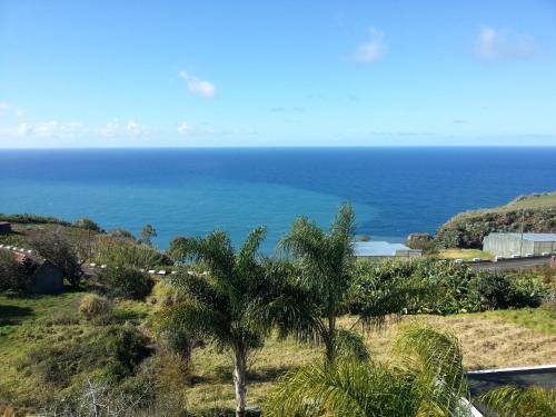 a view of the ocean from a house at Sunshine Villa 150m above Ocean & Sandy Beach in Estreito da Calheta