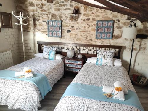 Postel nebo postele na pokoji v ubytování Casa Rural "El Olivo"