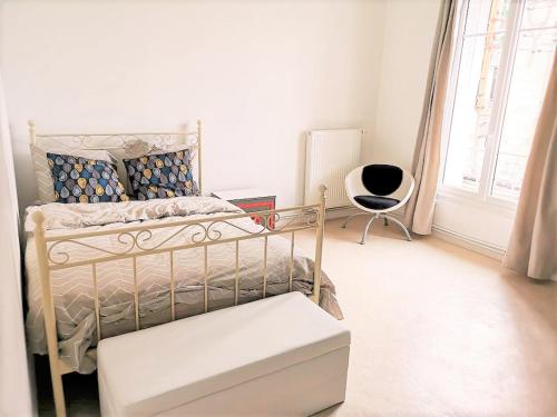 En eller flere senge i et værelse på Greyhound - Grand Appartement centre-ville