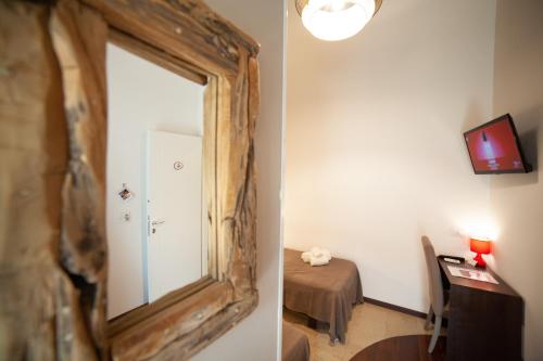 Μια τηλεόραση ή/και κέντρο ψυχαγωγίας στο B&B Ninfeo Siracusa - Rooms & Breakfast