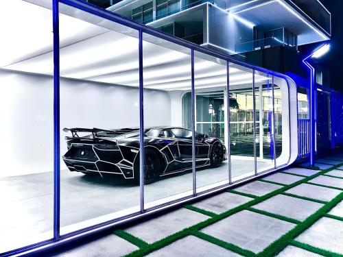 a garage with a car on the side of a building at Number One Oxford Street Hotel & Suites in Accra