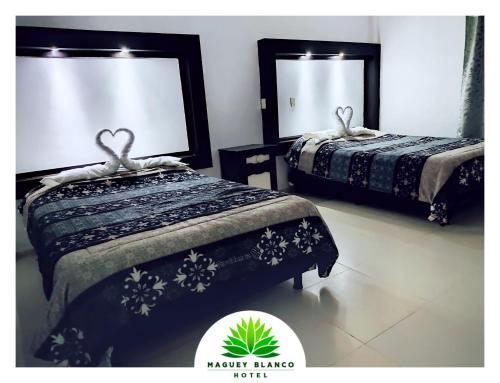 Postel nebo postele na pokoji v ubytování Hotel Maguey blanco