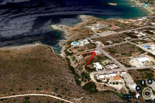 an aerial view of an island next to the water at Magnificent sea view,clean and bright apartments in Kalathas
