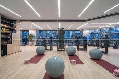 a gym with exercise equipment in a building at Star Residence ICC Guangzhou in Guangzhou