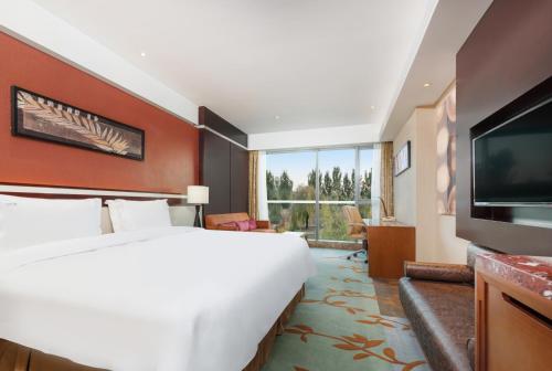 Postel nebo postele na pokoji v ubytování Holiday Inn Beijing Shijingshan Parkview by IHG