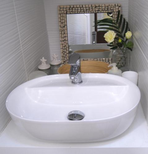 a white sink in a bathroom with a mirror at Tourist House Bologna - Self check-in in Bologna