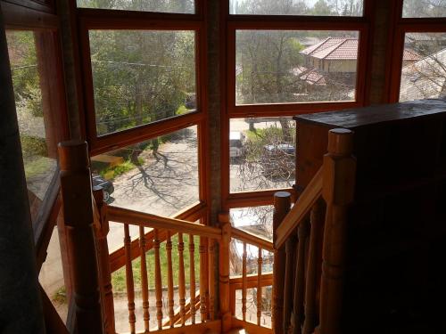 a view from the inside of a house with a window at Porkoláb Apartmanház in Gyenesdiás