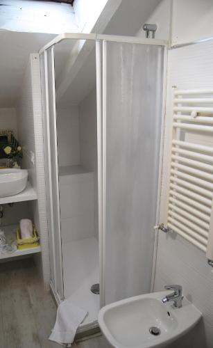 a white bathroom with a shower and a sink at 2-Tourist House Bologna-Altavista - Self check-in in Bologna